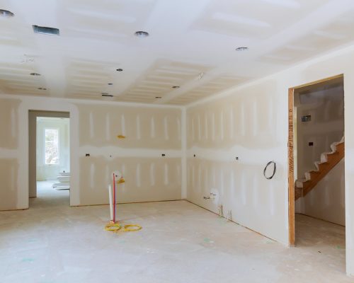 Drywall is hung in kitchen remodeling project Interior of apartment with materials during on the